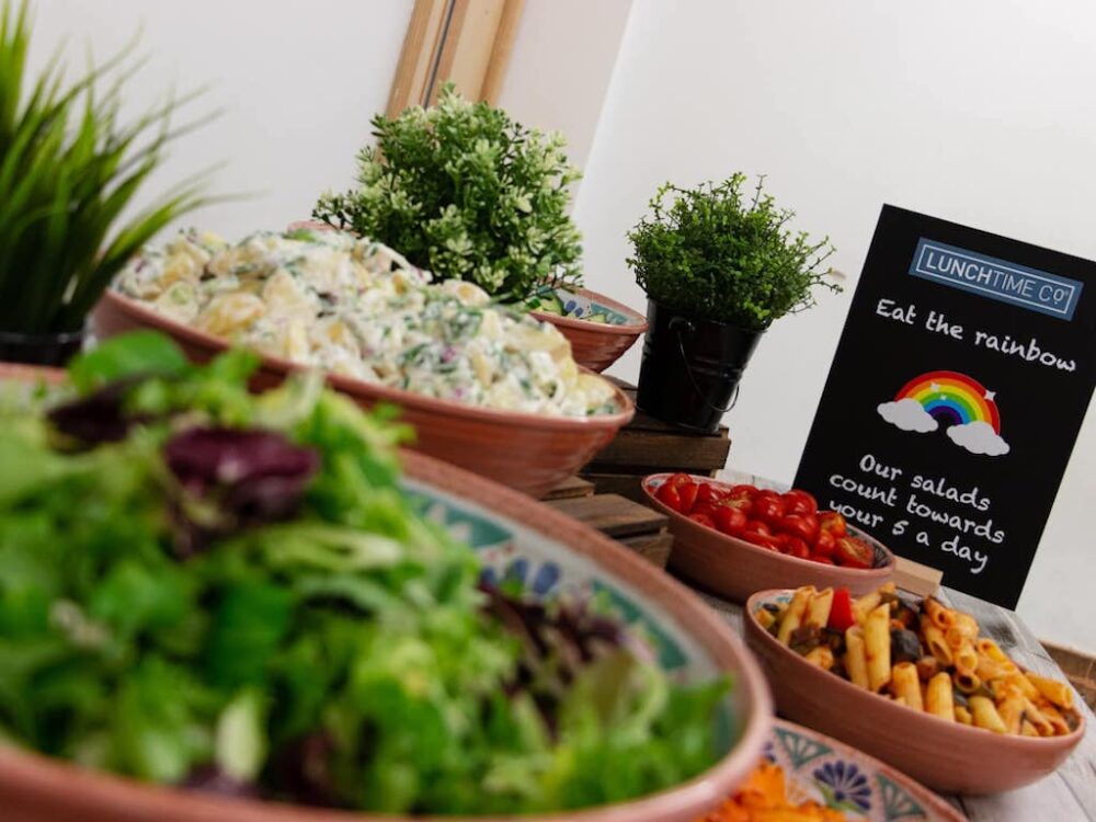 An array of salad items in bowls